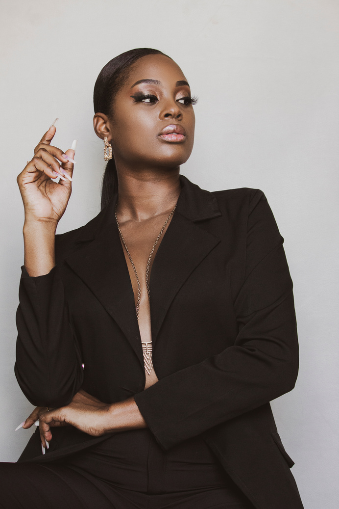 A Woman in Black Blazer Posing